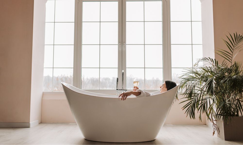 A woman enjoy a relaxing, comfortable soak in a bath