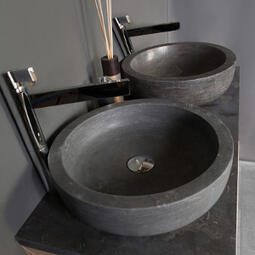 grey stone basin with tall tap
