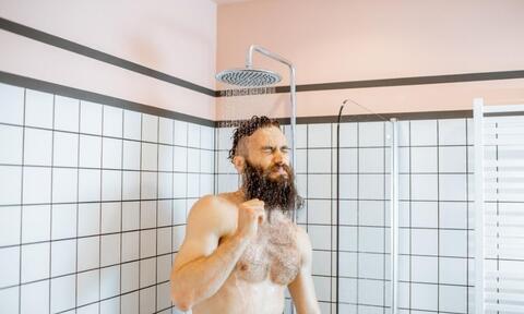 Man Showering With Low Temperature Water