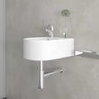 Round bottle trap in chrome, compact space-saving design shown installed beneath wall hung basin