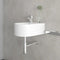 Round bottle trap in chrome, compact space-saving design shown installed beneath wall hung basin