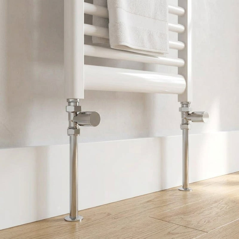Pair of chrome round radiator valves fitted to a white heated towel rail