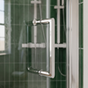 Close-up of the chrome D-shaped handle on the bifold shower door