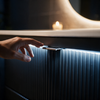 Close-up of the motion-sensor LED lighting washing down the fluted black drawer front of the Linnea vanity unit