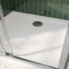 White anti-slip shower tray with round chrome 90mm waste at the back