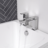 Close-up of the square Slade deck-mounted bath filler mixer tap on the bath rim