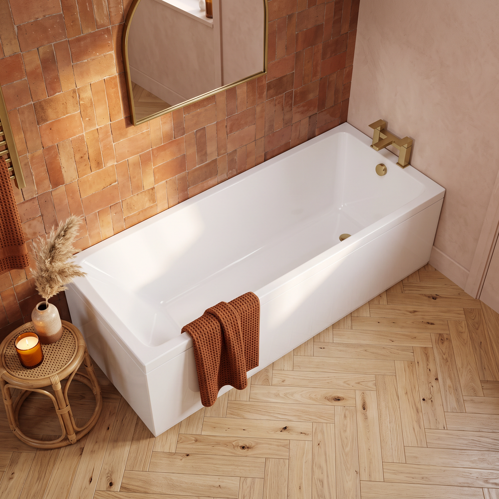 1800 x 800 Slim single ended bath with white panels and brushed gold bath filler tap in a warm bathroom