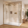 Brushed brass square rain shower running inside the walk-in enclosure