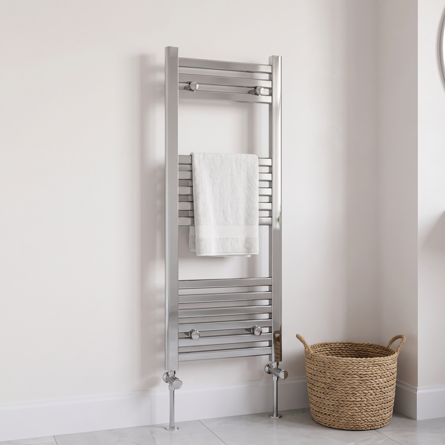 300 x 800mm chrome heated towel rail with angled radiator valves and a white towel