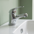 Side profile of the Poma chrome round mono mixer showing spout reach over the basin