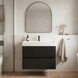 Linnea 700mm matt black wall hung vanity with fluted top drawer and white basin in a plaster-walled bathroom