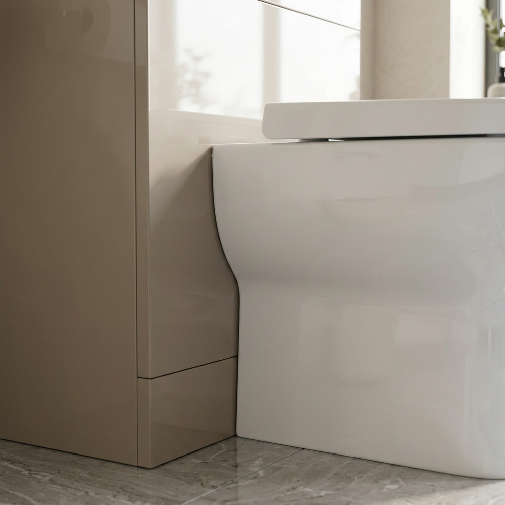 Detail of the light taupe latte high-gloss finish on the Pemberton WC unit beside the white pan