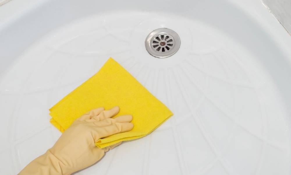 Gloved-Hand-Cleaning-Shower-Enclosure