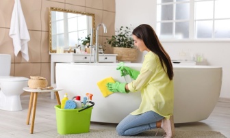 Woman Cleaning a Bathtub
