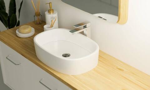 White Basin Sits On Wooden Surface Vanity Unit