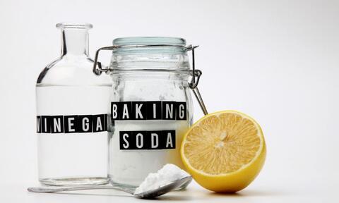 Two Bottles Filled With Vinegar and Baking Soda