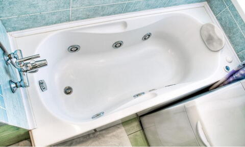 White Rectangular Whirlpool Bath In Bathroom