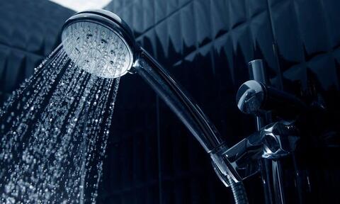 Chrome Shower Heads Spraying Water