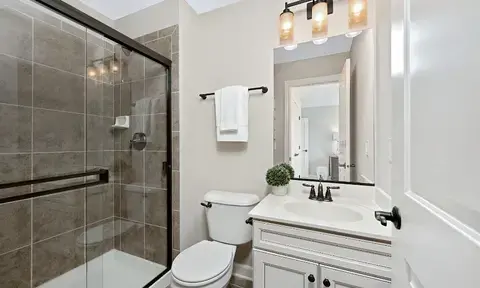 Small Bathroom With Shower, Toilet, and Small Vanity Unit