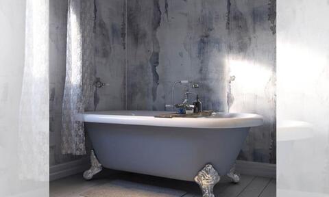 Blue Bathtub in Bathroom With Waterproof Wall Tiling