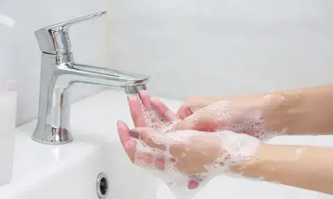 Woman Washing Hands With Soap