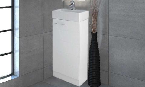 small white cloakroom basin and storage cabinet