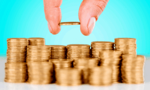 Fingers Holding Money Coin and Stack of Money Coin